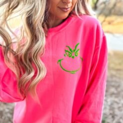 Pink and green Grinch face sweatshirt