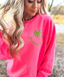Pink and green Grinch face sweatshirt